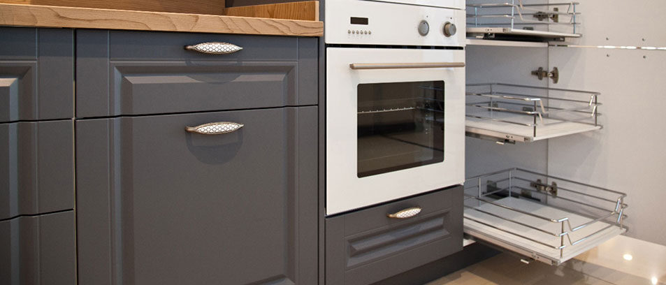 Grey cabinetry with pull-out wire basket storage