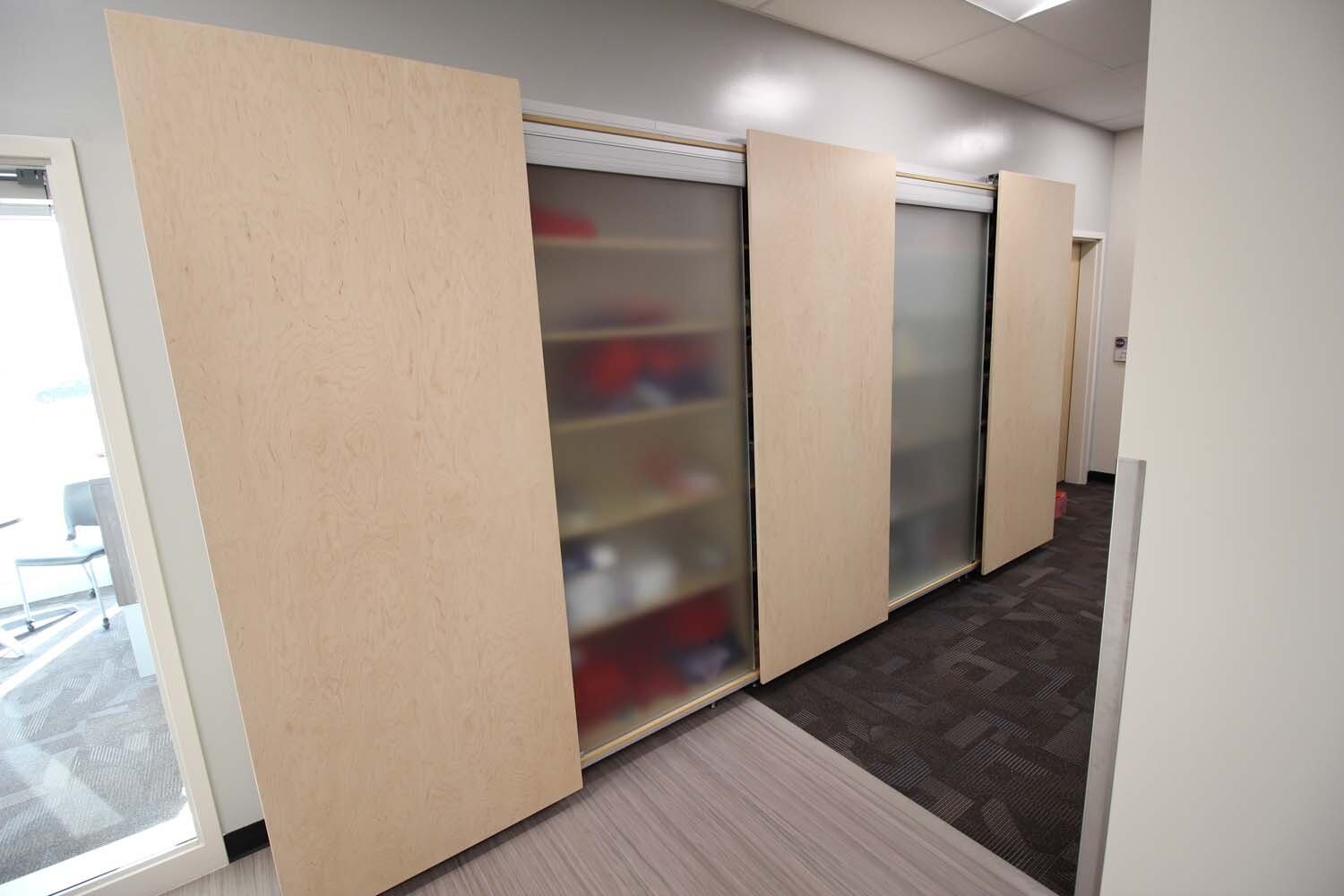 Sliding-panel storage cabinets