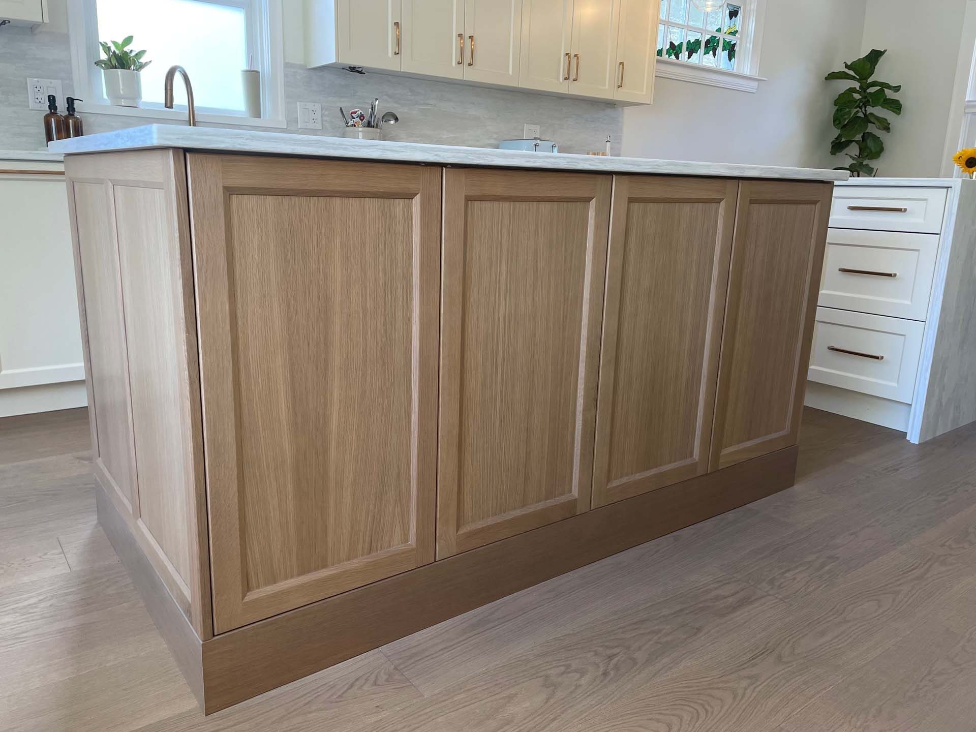 Custom kitchen cabinetry with island and pendant lighting